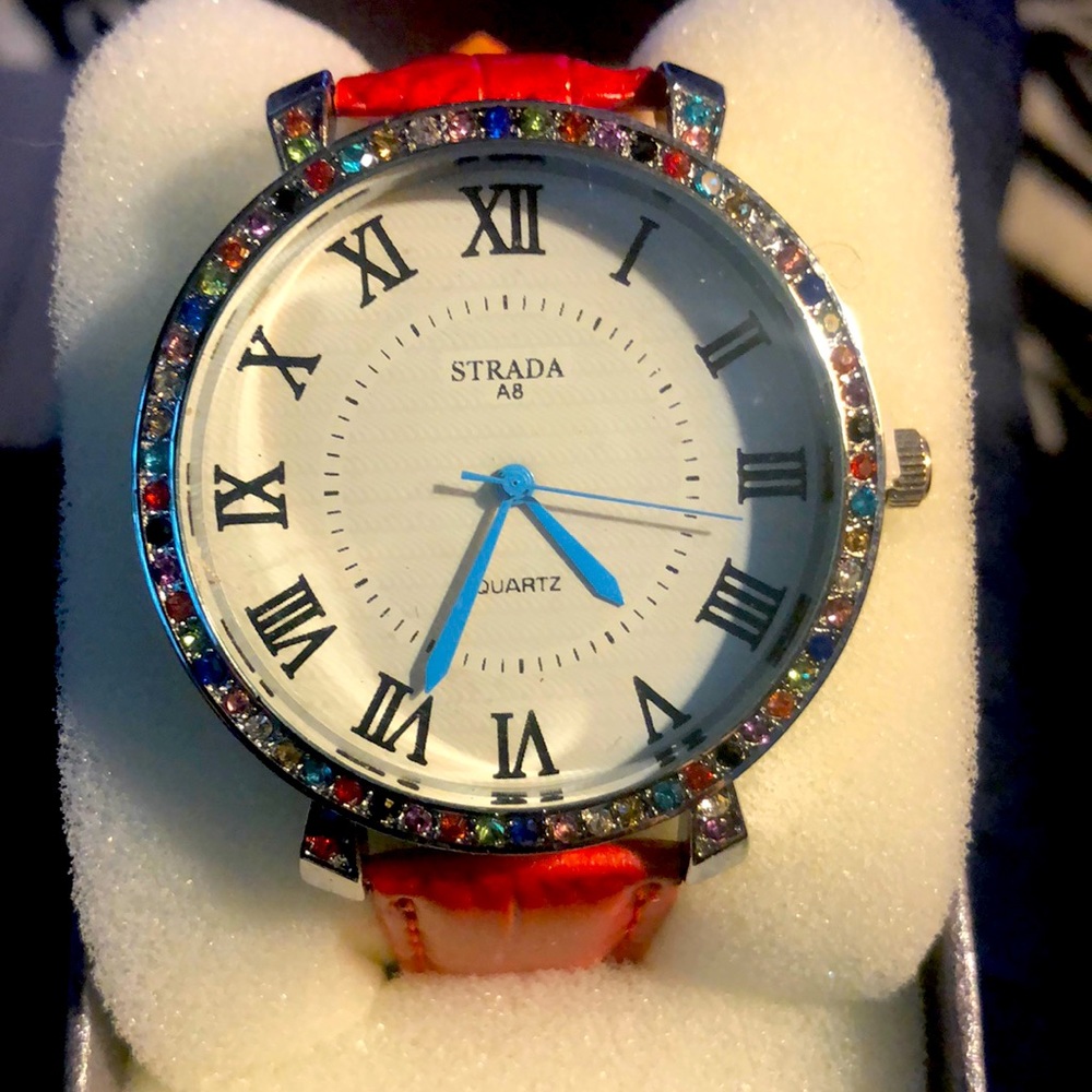 Red wristband, faux leather, bejeweled bezel watch with blue hands